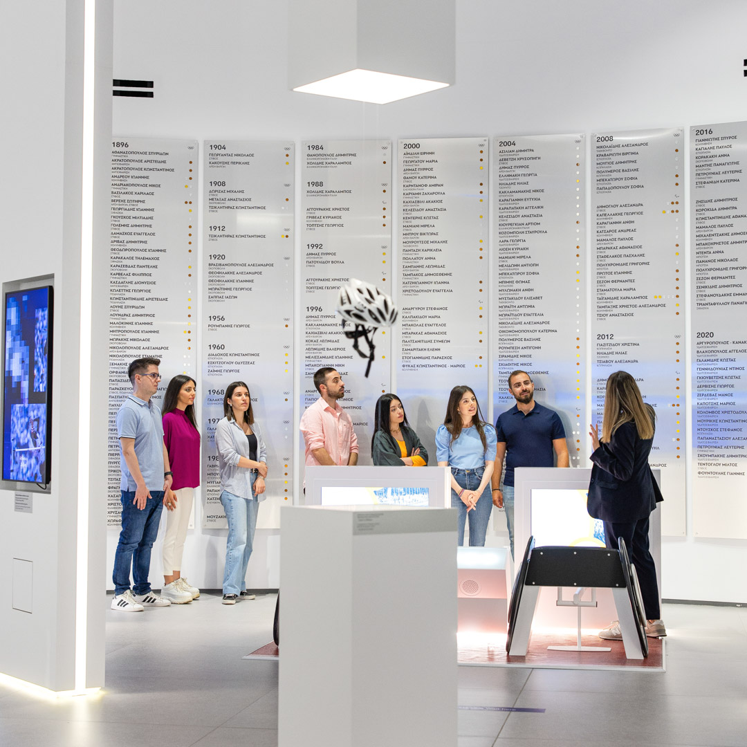 Visitors in front of the Olympic winners timeline at the Athens Olympic Museum